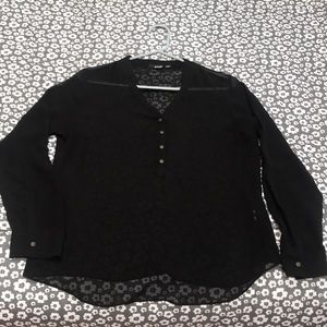 Long sleeved sheer dressy top.